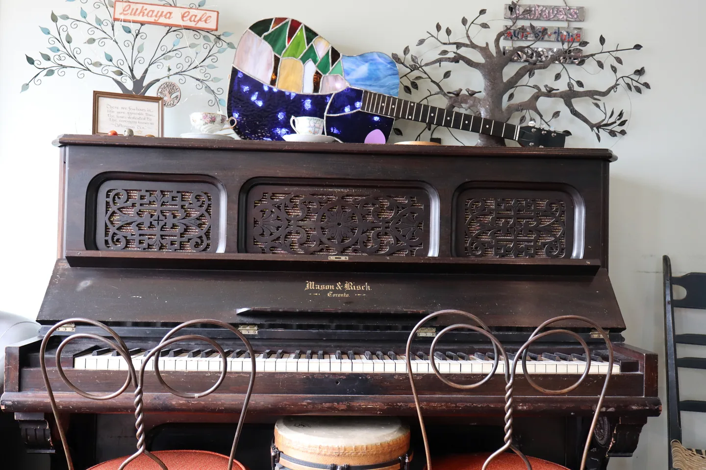 The piano and guitar decoration inside Lukaya Cafe